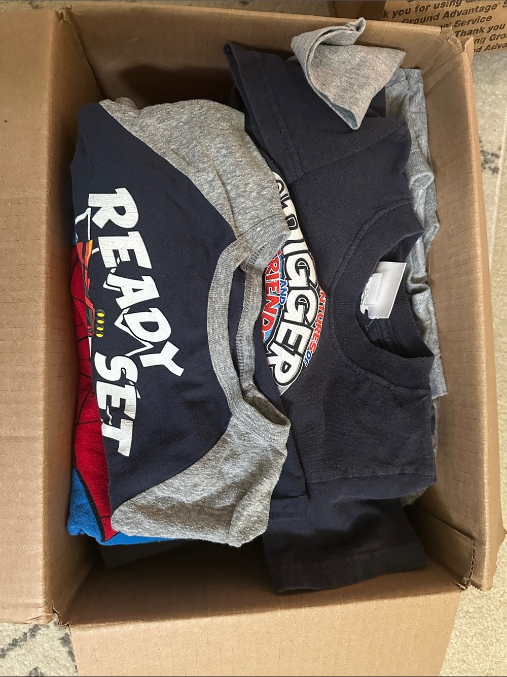 Kids size 5T XS S box if misc items that can include pants, shirts, shorts PJs e
